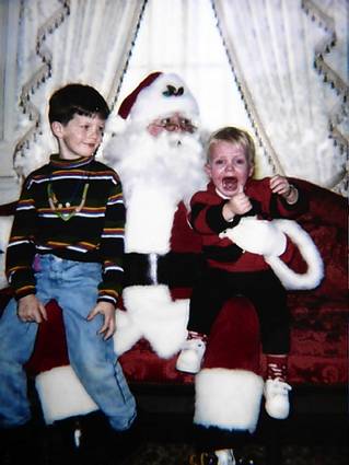 crying-kid-with-older-brother-on-santas-lap.jpg
