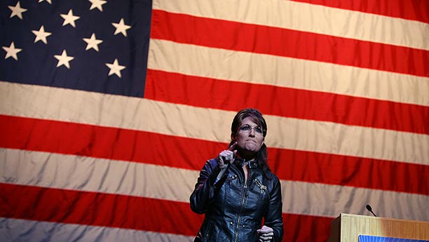 palin-in-front-of-huge-flag.jpg