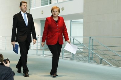 anglia-merkel-with-greece-guy.jpg