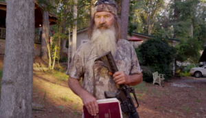 Phil-Robertson-With-Gun-e1414460385212-665x385