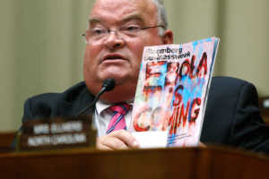 Long holds up a copy of a magazine with an Ebola headline as public health officials testify before a House Energy and Commerce Oversight and Investigations Subcommittee hearing on the U.S. response to the Ebola crisis, in Washington