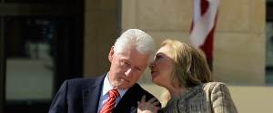 Hillary wispering into Bils ears