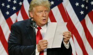 trump-reading-papers-idiot