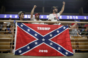 (L-R)Brandon Miles, Brandon Partin and Michael Miles cheer before Republican U.S. presidential nominee Donald Trump attends a campaign rally at the Silver Spurs Arena in Kissimmee, Florida August 11, 2016. REUTERS/Eric Thayer - RTSMSW0