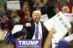 Republican presidential candidate Donald Trump gestures as he speaks at a campaign rally Friday, Feb. 5, 2016, in Florence, S.C. (AP Photo/John Bazemore)